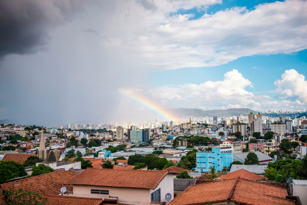 a rainbow in the sky over a city